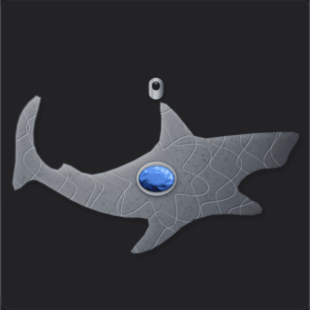 Shark Attack pendant — a hammerhead shark casting set with a blue gem